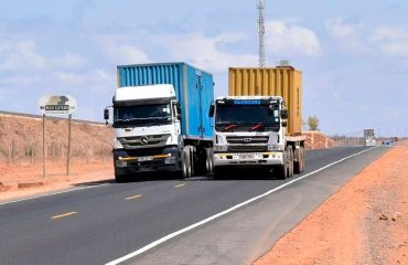 Container trucks hauling freight on the northern corridor