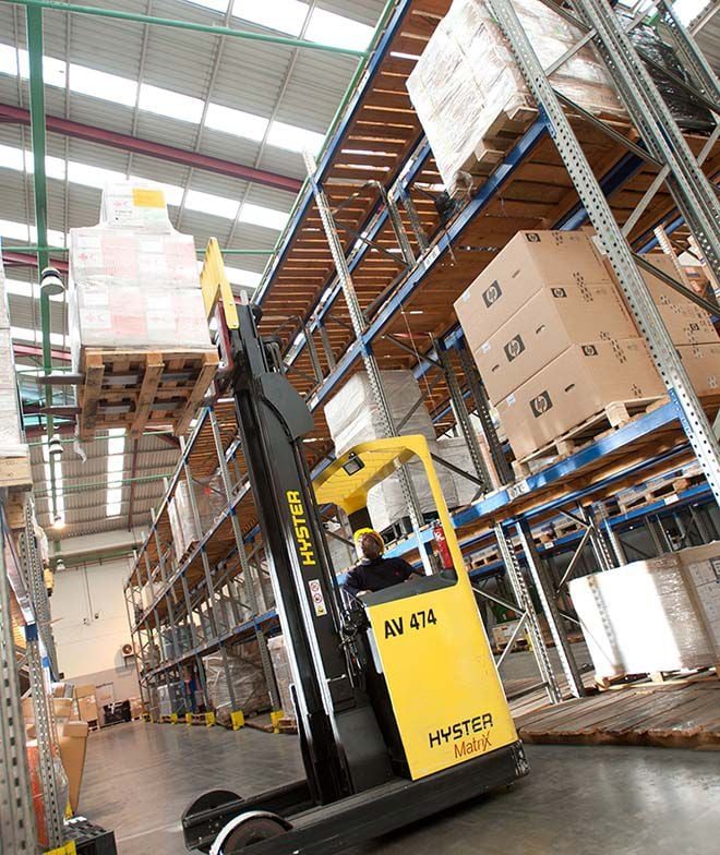 A forklift moving palletised cargo inside a Nairobi cargo warehouse