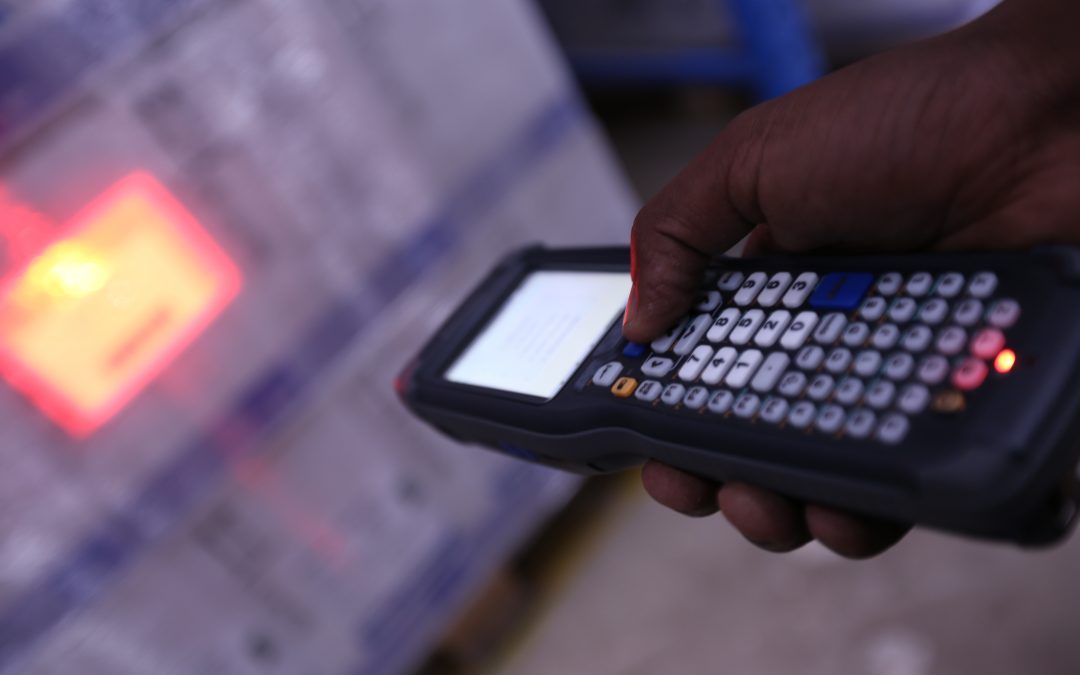 A handheld barcode scanner used in warehouse receiving