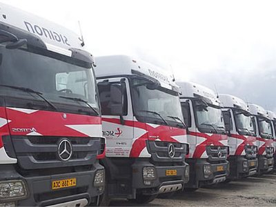 A row of heavy trucks ready for loading
