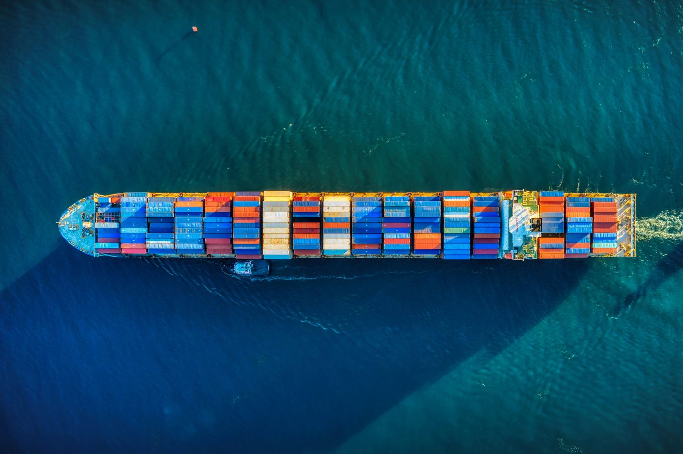 Aerial view of a container vessel in coastal waters