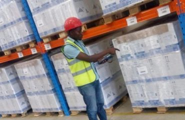 A warehouse worker scanning palletised stock
